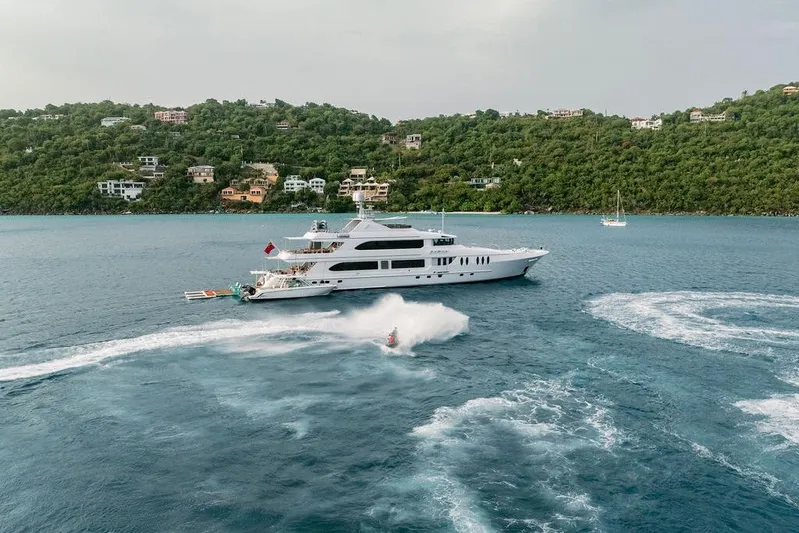 Just Enough Yacht Photos Pics Luxury yacht Ares Custom Marine 141 cruising near lush coastline, 2012 model.