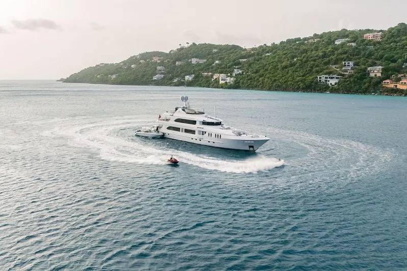 Just Enough Yacht Photos Pics Luxurious 2012 Ares Custom Marine yacht cruising near scenic coastline.