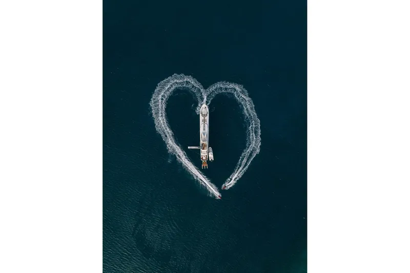 Just Enough Yacht Photos Pics Aerial view of 2012 Ares Custom Marine 141 yacht with heart-shaped wake.