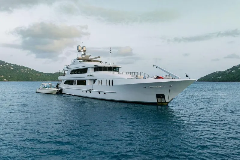 Just Enough Yacht Photos Pics Luxurious 2012 Ares Custom Marine 141 yacht anchored in serene waters.