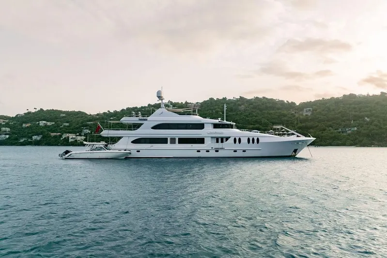 Just Enough Yacht Photos Pics Luxury yacht Ares Custom Marine Custom 141, 2012, anchored in scenic coastal waters.