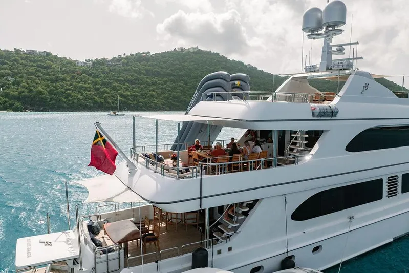 Just Enough Yacht Photos Pics Luxurious 2012 Ares Custom Marine yacht, Custom 141, docked in scenic waters.