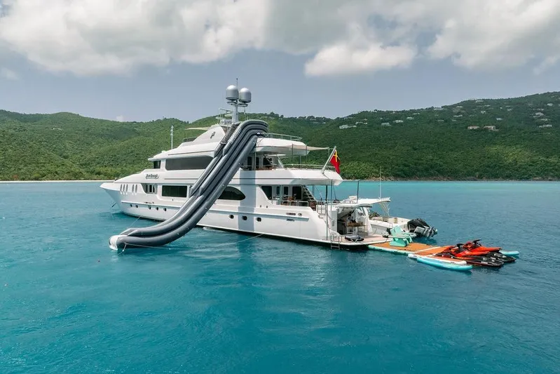 Just Enough Yacht Photos Pics Luxury yacht Ares Custom Marine 141, 2012, with slide and jet skis in tropical waters.