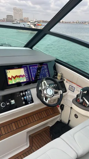 Mi Olvido Yacht Photos Pics 2023 Sea Ray Sundancer 320 Outboard helm with advanced navigation displays and luxurious interior.