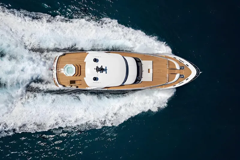 Eden Yacht Photos Pics Aerial view of 2022 Maiora 30 Walkaround yacht cruising on the ocean.