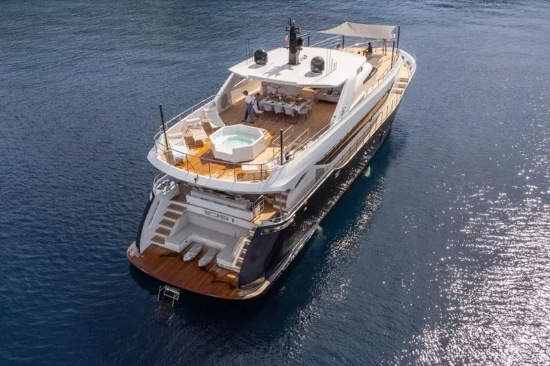Eden Yacht Photos Pics Luxurious 2022 Maiora 30 Walkaround yacht with spacious deck and jacuzzi on calm waters.