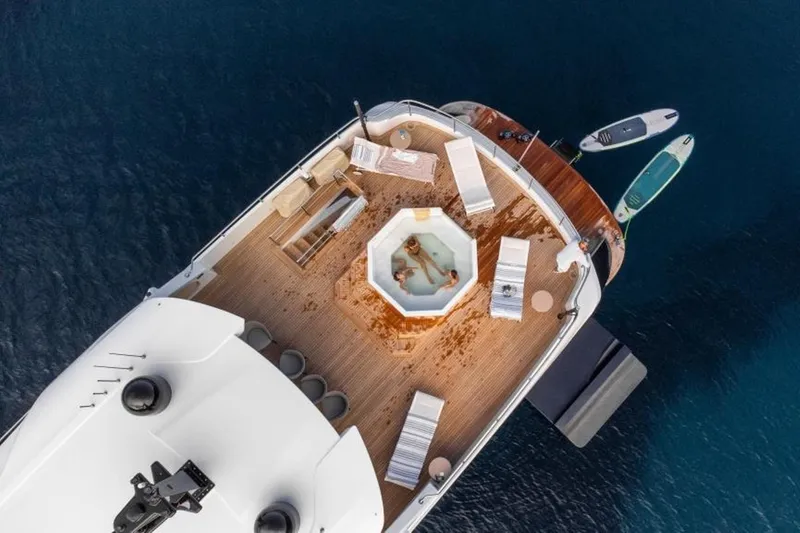 Eden Yacht Photos Pics Luxurious 2022 Maiora 30 Walkaround yacht with jacuzzi and sun loungers on deck.