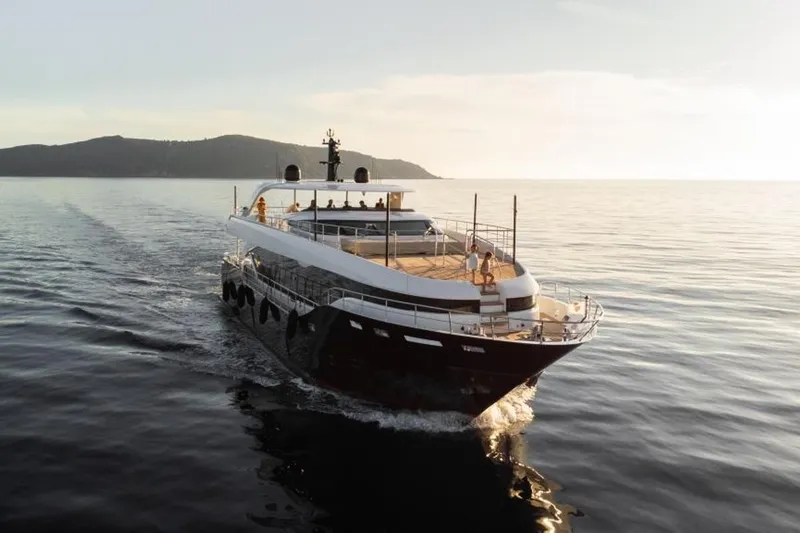 Eden Yacht Photos Pics 2022 Maiora 30 Walkaround yacht cruising on calm sea at sunset.