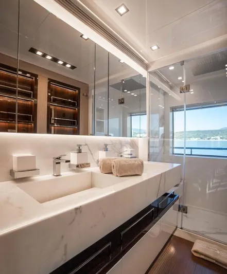 Eden Yacht Photos Pics Luxurious bathroom on 2022 Maiora 30 Walkaround yacht with modern fixtures and ocean view.