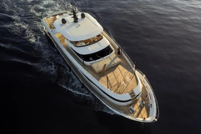 Eden Yacht Photos Pics 2022 Maiora 30 Walkaround yacht cruising on calm waters at sunset.