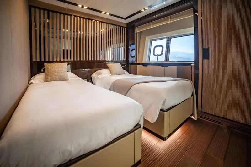 Eden Yacht Photos Pics Luxurious twin bedroom on 2022 Maiora 30 Walkaround yacht with modern design and large window.