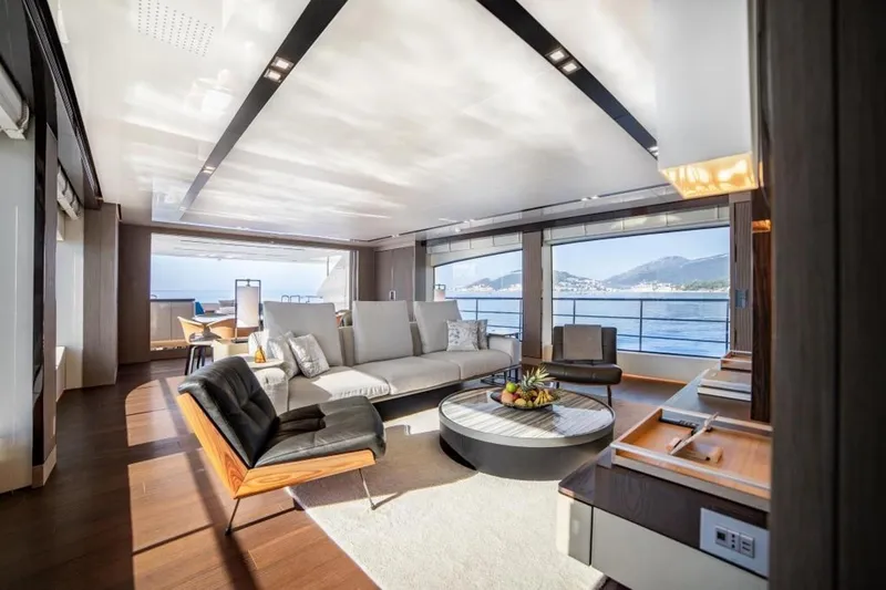 Eden Yacht Photos Pics Luxurious interior of 2022 Maiora 30 Walkaround yacht with modern furnishings and ocean view.