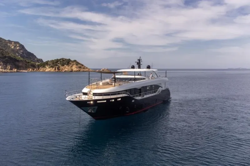 Eden Yacht Photos Pics Luxury Maiora 30 Walkaround yacht, 2022 model, cruising in serene coastal waters.