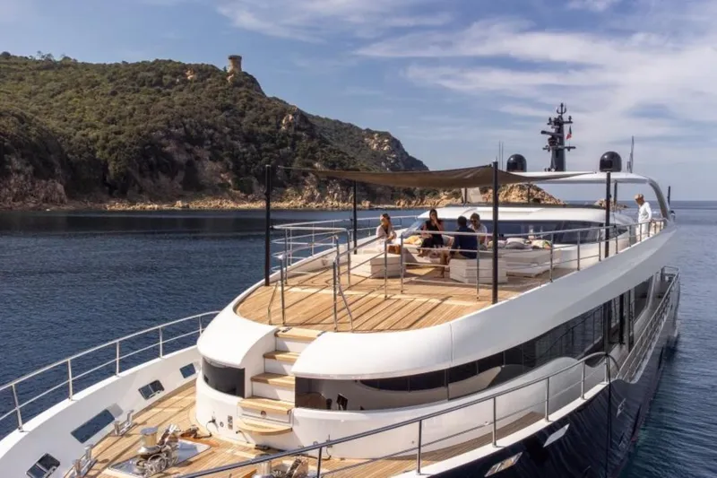 Eden Yacht Photos Pics Luxurious 2022 Maiora 30 Walkaround yacht cruising near scenic coastline.
