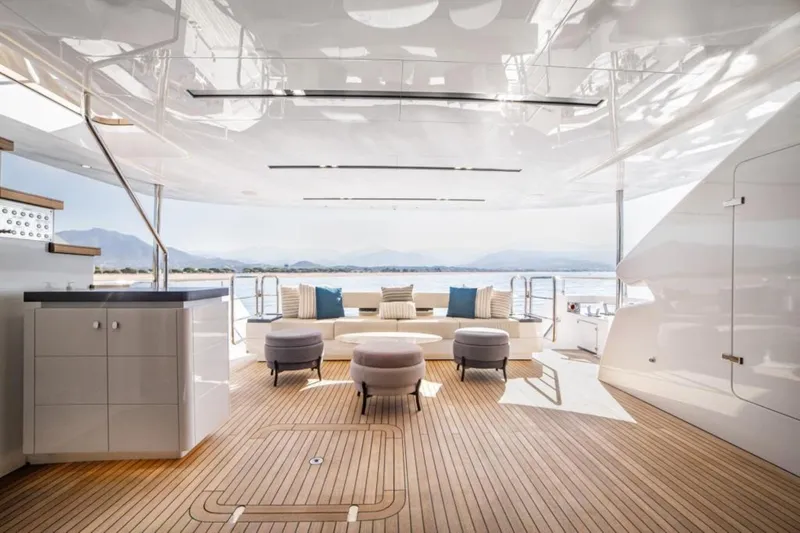 Eden Yacht Photos Pics Luxurious 2022 Maiora 30 Walkaround yacht interior with elegant seating and ocean view.