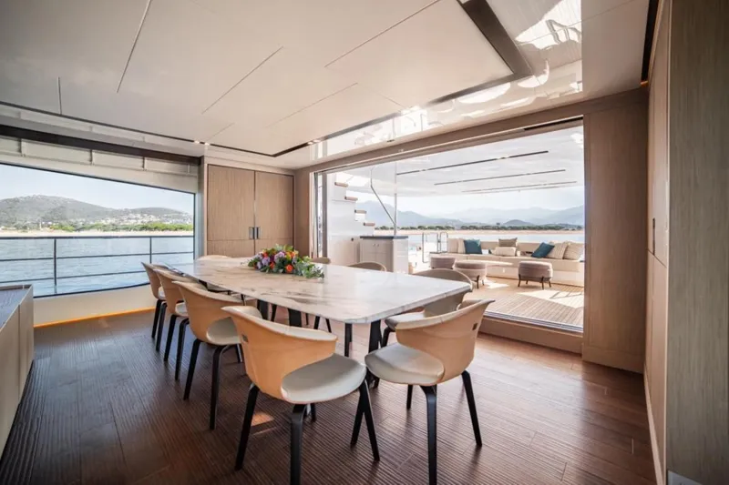 Eden Yacht Photos Pics Luxurious dining area on 2022 Maiora 30 Walkaround yacht with scenic ocean view.