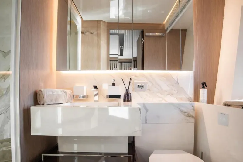 Eden Yacht Photos Pics Luxurious bathroom interior on 2022 Maiora 30 Walkaround yacht, featuring modern design and elegant fixtures.