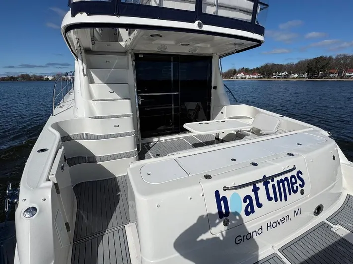  Yacht Photos Pics 2005 Sea Ray 500 Sedan Bridge yacht docked, featuring spacious deck and elegant design.