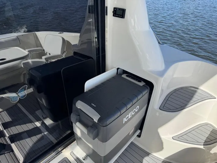  Yacht Photos Pics 2005 Sea Ray 500 Sedan Bridge with ICECO cooler on deck, near water.