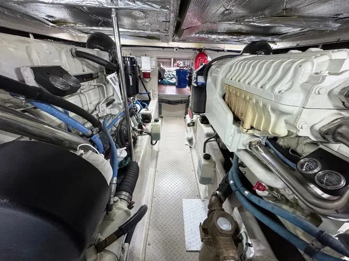  Yacht Photos Pics Engine room of a 2005 Sea Ray 500 Sedan Bridge yacht, showcasing dual engines and mechanical components.