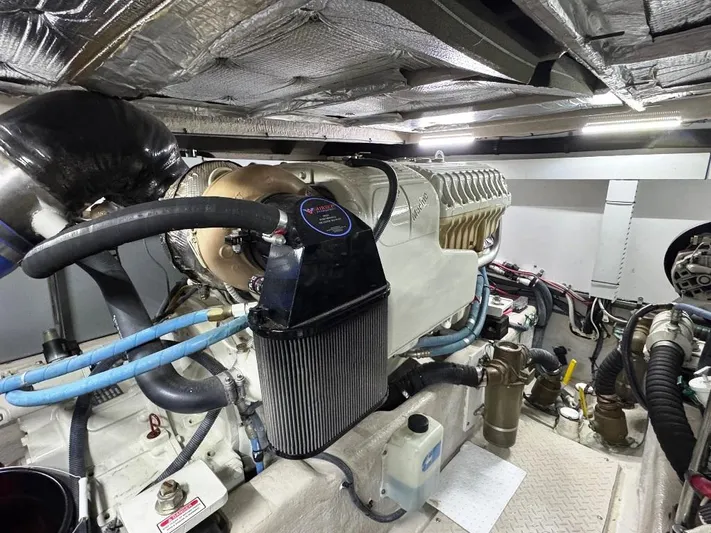  Yacht Photos Pics Engine room of a 2005 Sea Ray 500 Sedan Bridge yacht, showcasing mechanical components.