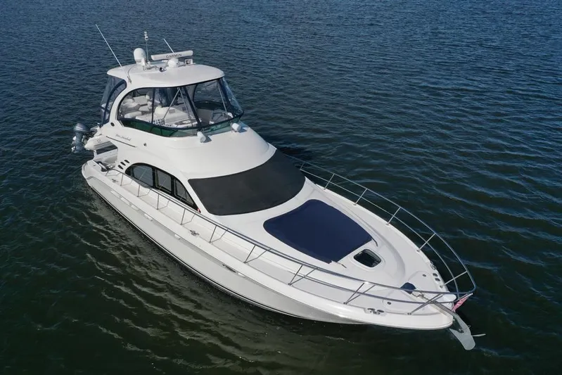  Yacht Photos Pics 2005 Sea Ray 500 Sedan Bridge yacht cruising on open water.