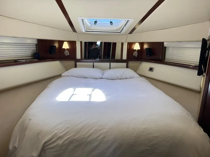  Yacht Photos Pics Luxurious bedroom interior of 2005 Sea Ray 500 Sedan Bridge yacht with skylight.
