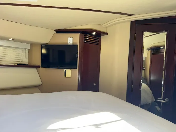  Yacht Photos Pics Interior of 2005 Sea Ray 500 Sedan Bridge with TV and mirrored door.