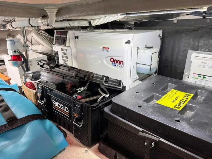  Yacht Photos Pics Engine room of 2005 Sea Ray 500 Sedan Bridge with Onan generator and toolboxes.