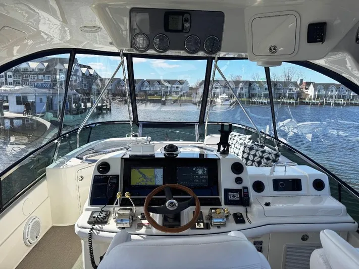  Yacht Photos Pics Interior view of 2005 Sea Ray 500 Sedan Bridge yacht cockpit with navigation equipment.