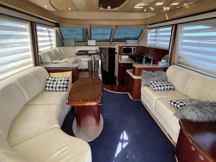  Yacht Photos Pics Luxurious interior of a 2005 Sea Ray 500 Sedan Bridge yacht with elegant seating.