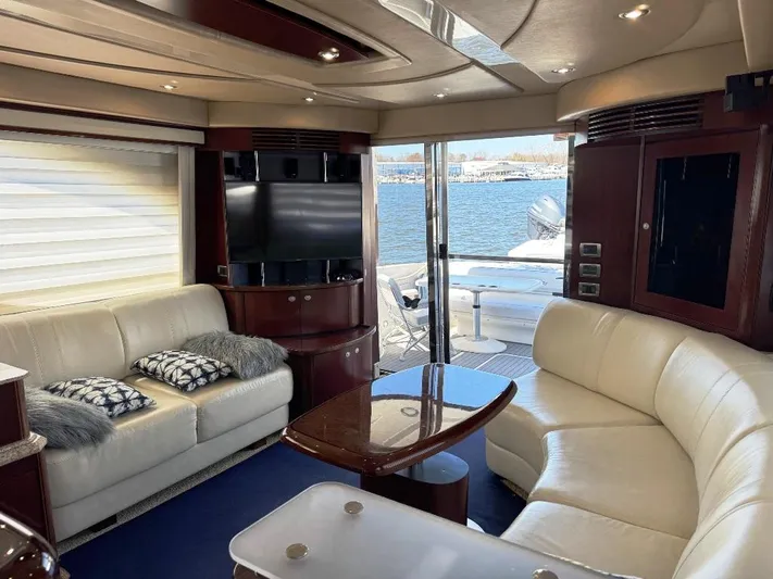  Yacht Photos Pics Luxurious interior of 2005 Sea Ray 500 Sedan Bridge yacht with leather seating and waterfront view.