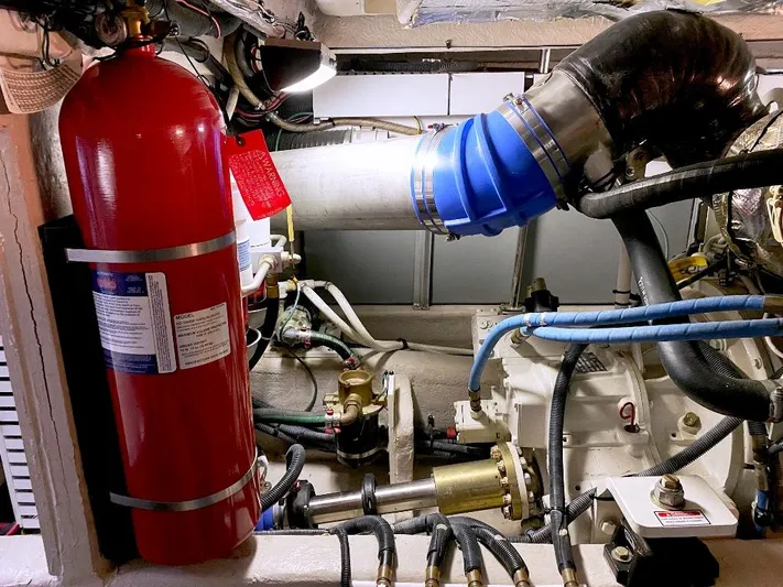  Yacht Photos Pics Engine room of 2005 Sea Ray 500 Sedan Bridge with fire extinguisher and mechanical components.