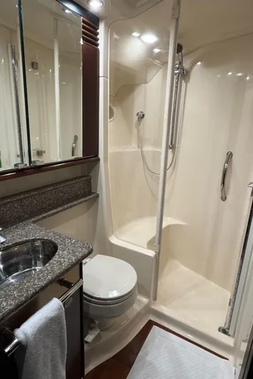  Yacht Photos Pics Luxurious bathroom in 2005 Sea Ray 500 Sedan Bridge yacht with shower and granite countertop.