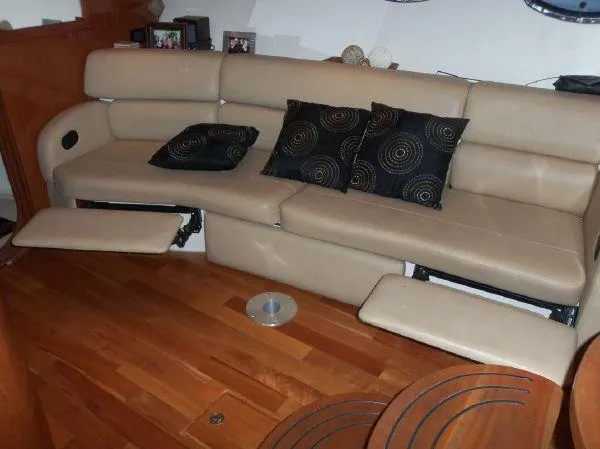  Yacht Photos Pics Luxurious beige leather seating with black patterned cushions on a 2009 Regal Commodore 4060 yacht.