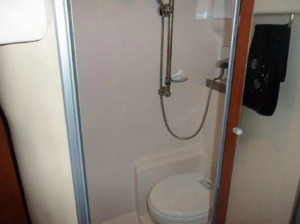  Yacht Photos Pics Compact bathroom in 2009 Regal Commodore 4060 yacht with shower and toilet.