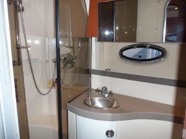  Yacht Photos Pics 2009 Regal Commodore 4060 yacht bathroom with shower, sink, and mirror.