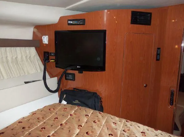  Yacht Photos Pics Interior of 2009 Regal Commodore 4060 yacht with TV and wood paneling.