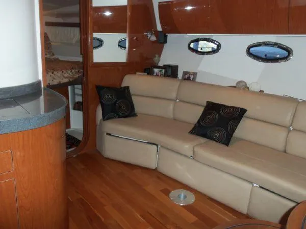  Yacht Photos Pics Luxurious interior of 2009 Regal Commodore 4060 yacht with leather seating and wood accents.