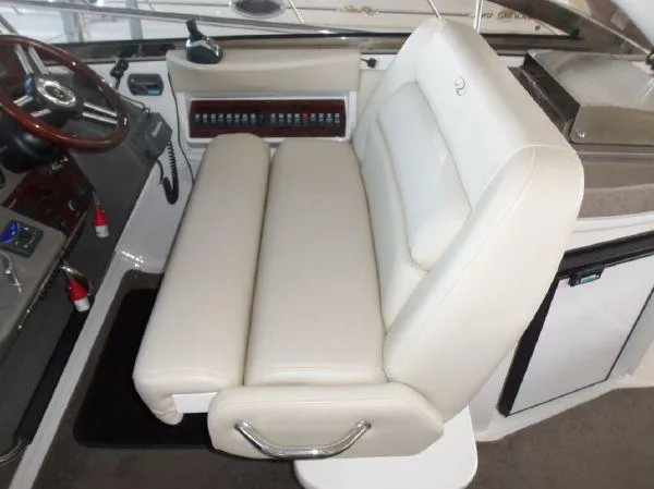  Yacht Photos Pics 2009 Regal Commodore 4060 boat interior with white leather seating and control panel.