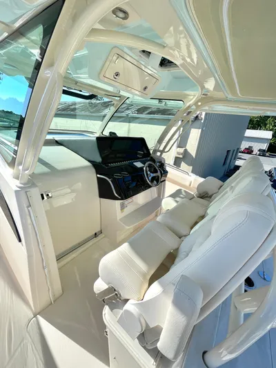  Yacht Photos Pics 2025 Grady-White Canyon 386 boat interior with modern helm and seating.