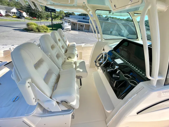  Yacht Photos Pics 2025 Grady-White Canyon 386 boat interior with luxurious seating and advanced dashboard controls.