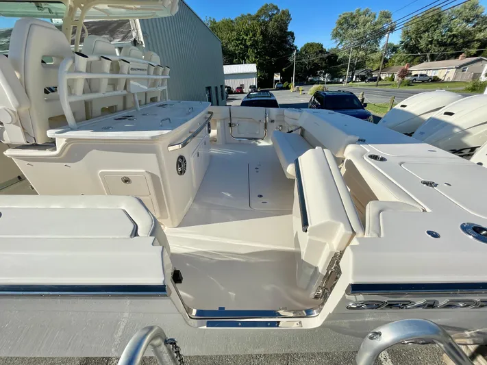  Yacht Photos Pics 2025 Grady-White Canyon 386 boat interior with seating and storage compartments.