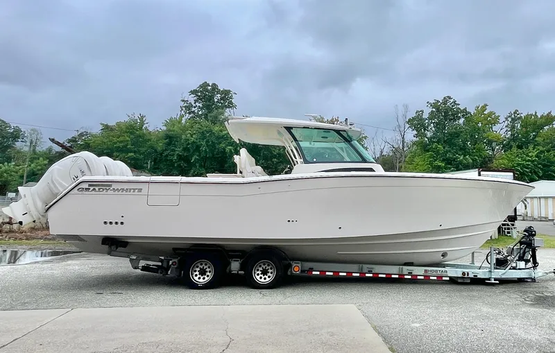  Yacht Photos Pics 2025 Grady-White Canyon 386 boat on trailer, parked outdoors.