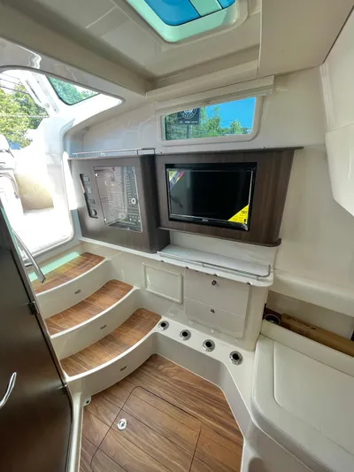  Yacht Photos Pics 2025 Grady-White Canyon 386 interior with wood flooring and modern amenities.