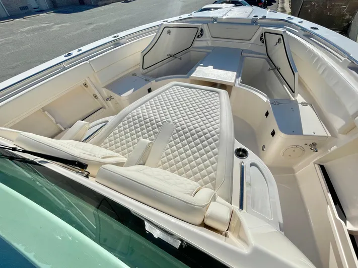  Yacht Photos Pics 2025 Grady-White Canyon 386 boat interior with luxurious seating and modern design.