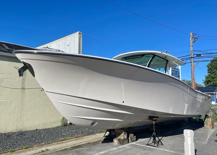  Yacht Photos Pics 2025 Grady-White Canyon 386 boat on display, sleek design, outdoor setting.