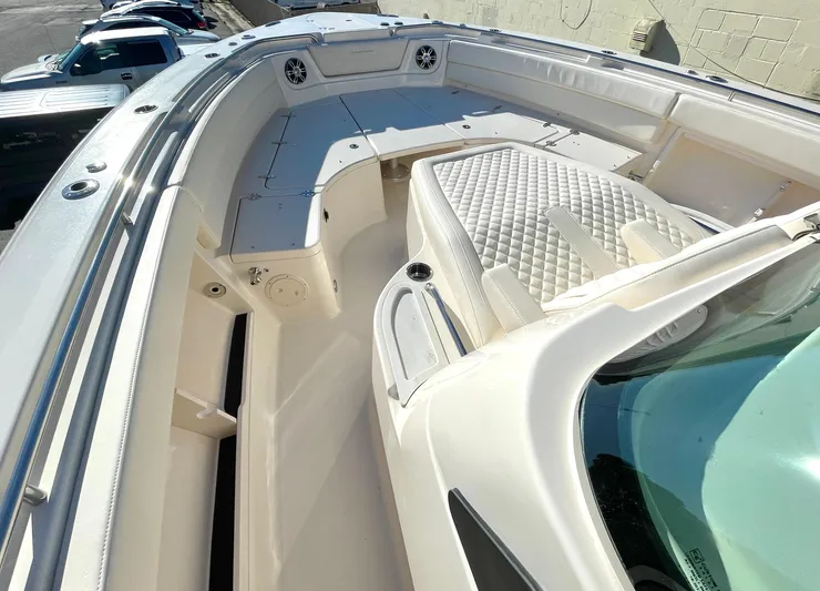  Yacht Photos Pics 2025 Grady-White Canyon 386 boat interior with cushioned seating and sleek design.