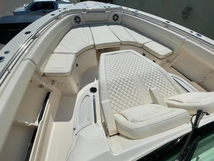  Yacht Photos Pics 2025 Grady-White Canyon 386 boat interior with luxurious white seating and spacious layout.