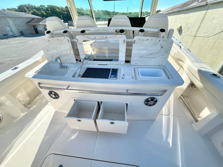  Yacht Photos Pics 2025 Grady-White Canyon 386 boat interior with open storage and seating.